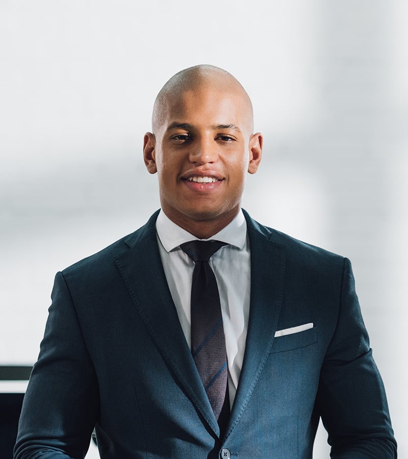 young-african-american-businessman-holding-digital-FYREY7J.jpg